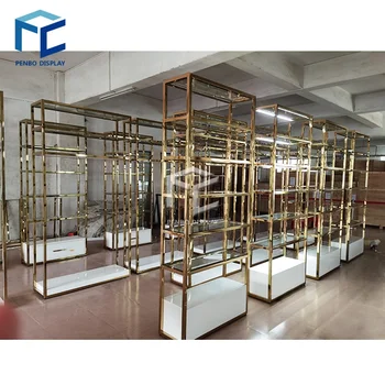 Изготовленная на заказ высококачественная золотая витрина Дизайн мебельной подставки для магазина одежды Стеллаж для выставки одежды